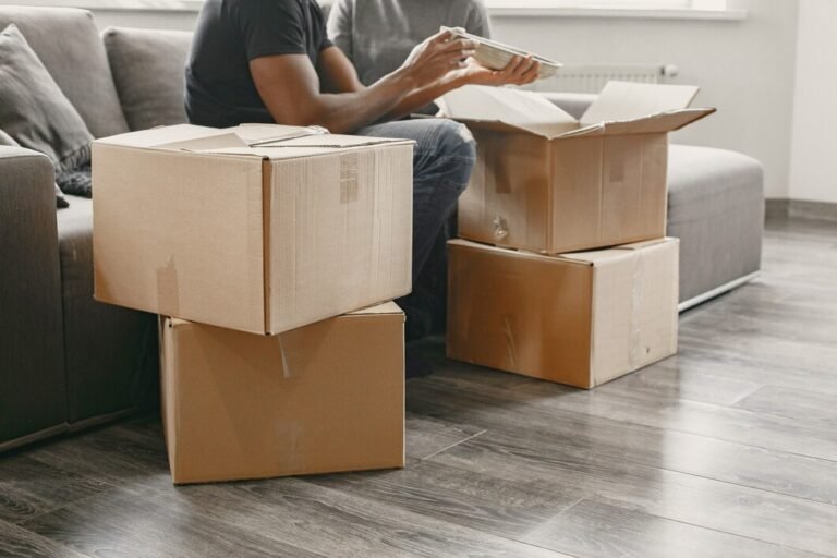 portrait young couple with cardboard boxes new home moving house concept 1157 47980