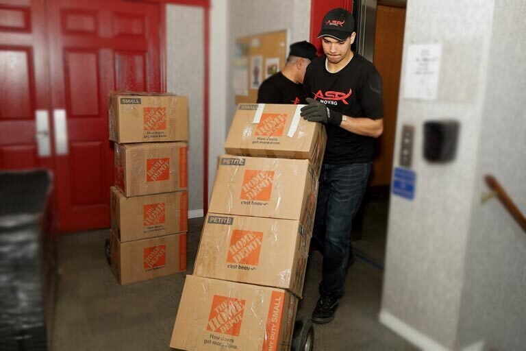 Edmonton movers moving boxes on dolly